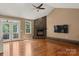 Bright living room boasting hardwood floors, fireplace, vaulted ceiling, and natural light at 1819 Brompton Ct, Newton, NC 28658