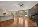 Open living area with a fireplace, hardwood floors, and seamless flow to the kitchen at 1819 Brompton Ct, Newton, NC 28658