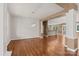 Spacious living room showcasing an open layout with hardwood floors and modern chandelier at 1819 Brompton Ct, Newton, NC 28658