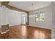 Bright living room featuring hardwood floors, modern lighting fixture, and natural light at 1819 Brompton Ct, Newton, NC 28658