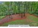 Serene backyard view showcases the natural landscaping and mature trees at 20312 Deep Cove Ct, Cornelius, NC 28031
