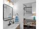 Stylish bathroom with modern fixtures, a decorative mirror, and updated design elements at 20312 Deep Cove Ct, Cornelius, NC 28031