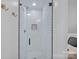 This bathroom showcases a white tile shower and a decorative mosaic accent, offering a clean and stylish space at 20312 Deep Cove Ct, Cornelius, NC 28031