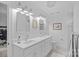 Modern bathroom with double sinks, vanity, and contemporary fixtures at 20312 Deep Cove Ct, Cornelius, NC 28031
