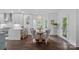 Charming dining area with a round wooden table, neutral chairs, and natural light at 20312 Deep Cove Ct, Cornelius, NC 28031