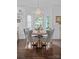 Elegant dining room featuring a round table with chairs, a chandelier, and abundant natural light from large windows at 20312 Deep Cove Ct, Cornelius, NC 28031