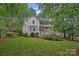 Charming two-story home with a spacious yard, multiple decks, and lush landscaping, perfect for outdoor living at 20312 Deep Cove Ct, Cornelius, NC 28031