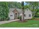 Stunning exterior featuring stone accents, manicured lawn and lovely curb appeal at 20312 Deep Cove Ct, Cornelius, NC 28031