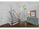 Bright foyer with soaring ceilings, dark hardwood floors, and staircase with white railings at 20312 Deep Cove Ct, Cornelius, NC 28031