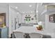 Well-lit kitchen with white cabinetry, stainless steel appliances, and quartz countertops at 20312 Deep Cove Ct, Cornelius, NC 28031