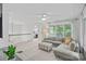 Spacious living area featuring a comfortable seating arrangement, natural light, and neutral decor at 20312 Deep Cove Ct, Cornelius, NC 28031
