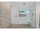 Modern bathroom features a luxurious tiled shower with glass enclosure and a built-in seat at 20312 Deep Cove Ct, Cornelius, NC 28031