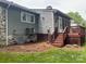 Exterior view of house featuring a deck, neutral siding, and surrounding greenery at 205 Wellington Hills Cir # 205, Salisbury, NC 28147