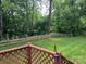 Well-manicured backyard with a wood fence and lush greenery, offering privacy and a connection to nature at 205 Wellington Hills Cir # 205, Salisbury, NC 28147