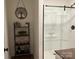 Bathroom featuring an alcove shower with transparent glass and a metal frame with storage rack at 205 Wellington Hills Cir # 205, Salisbury, NC 28147
