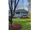 Charming single-story home with gray brick and siding, complemented by a well-manicured lawn and tree at 205 Wellington Hills Cir # 205, Salisbury, NC 28147