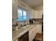 Bright kitchen featuring granite countertops, stainless steel appliances, and ample cabinet space at 205 Wellington Hills Cir # 205, Salisbury, NC 28147