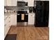 Modern kitchen featuring white cabinets, stainless steel appliances, and sleek countertops for a clean and efficient space at 205 Wellington Hills Cir # 205, Salisbury, NC 28147