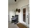 Enclosed porch with white walls, black rocking chair, neutral carpet and a glass door at 205 Wellington Hills Cir # 205, Salisbury, NC 28147