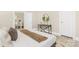 Bedroom showing neutral walls and decor and a view into the kitchen at 210 E 5Th Ave, Gastonia, NC 28054