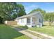 Exterior view of home with a driveway and fenced in yard at 210 E 5Th Ave, Gastonia, NC 28054