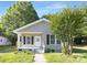 Charming single-story home with a welcoming porch and fresh landscaping at 210 E 5Th Ave, Gastonia, NC 28054