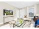 Well-lit living room features neutral walls, modern furniture, and an inviting atmosphere at 210 E 5Th Ave, Gastonia, NC 28054