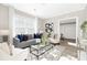 Cozy living room with neutral tones, modern furnishings and lots of natural light at 210 E 5Th Ave, Gastonia, NC 28054