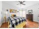 Comfortable bedroom with bright natural light, a ceiling fan, and wood laminate flooring at 212 Victoria Cir, York, SC 29745