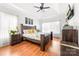 Serene bedroom with tray ceiling, wooden furniture, and lots of natural light at 212 Victoria Cir, York, SC 29745