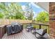 Outdoor living on this wooden deck with a grill and patio furniture, perfect for relaxing and entertaining at 212 Victoria Cir, York, SC 29745