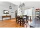 Spacious dining room with modern chandelier, seating for six, and wood floors at 212 Victoria Cir, York, SC 29745