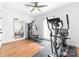 Home gym featuring a ceiling fan, neutral-colored walls, and an assortment of exercise equipment at 212 Victoria Cir, York, SC 29745