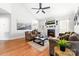 Bright living room features a fireplace, comfortable seating, and ceiling fan at 212 Victoria Cir, York, SC 29745