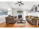 Cozy living room with a fireplace, plush seating, and ample natural light at 212 Victoria Cir, York, SC 29745