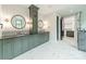 A luxury bathroom featuring double vanity with a stunning tile accent, marble floor and walk-in closet at 2412 Kingsbury Dr, Charlotte, NC 28205