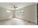 Bright, airy bedroom featuring a ceiling fan and large windows for natural light at 2412 Kingsbury Dr, Charlotte, NC 28205