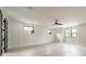 An airy bedroom featuring sleek ceiling fan, modern lighting, and beautiful light hardwood flooring at 2412 Kingsbury Dr, Charlotte, NC 28205
