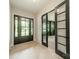 Bright foyer features stylish doors with glass panes and wood flooring at 2412 Kingsbury Dr, Charlotte, NC 28205