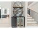 Hallway with bar area featuring a sink, wine cooler, and open shelving at 2412 Kingsbury Dr, Charlotte, NC 28205