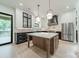 Gourmet kitchen features custom cabinets, marble countertops, and a large center island at 2412 Kingsbury Dr, Charlotte, NC 28205