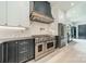 The kitchen features a sleek stainless steel range hood and appliances, complemented by modern cabinetry at 2412 Kingsbury Dr, Charlotte, NC 28205