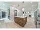 This open-concept kitchen features a stylish island with a marble countertop and an airy, well-lit space at 2412 Kingsbury Dr, Charlotte, NC 28205