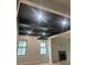 Living room features a modern black ceiling, recessed lighting, and a fireplace at 2412 Kingsbury Dr, Charlotte, NC 28205
