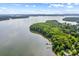 Aerial view showcases a serene lake surrounded by lush greenery at 270 Yachtsman Dr, Salisbury, NC 28146