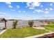 Enjoy a serene view from this backyard featuring lush lawn, a fire pit, and lake access with a private dock at 270 Yachtsman Dr, Salisbury, NC 28146