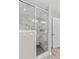 Bathroom shower featuring glass doors, tiled walls, and a modern shower head at 270 Yachtsman Dr, Salisbury, NC 28146