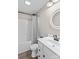 Cozy bathroom with a tub and shower, toilet, sink and vanity, updated lighting and fixtures, and wood-look flooring at 270 Yachtsman Dr, Salisbury, NC 28146