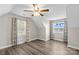 A bedroom with hardwood floors, vaulted ceilings, fan and light fixture, and windows with lake views at 270 Yachtsman Dr, Salisbury, NC 28146