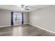 Bedroom with hardwood floors, a ceiling fan, and a window with a view of the lake at 270 Yachtsman Dr, Salisbury, NC 28146